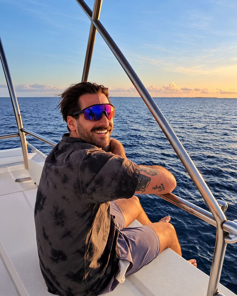 Jorge Figueira on a boat at sunset